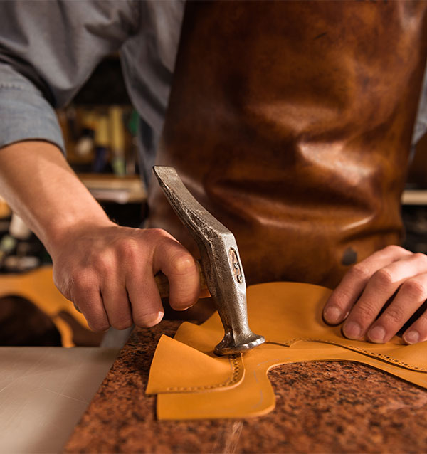 cobbler working with leather